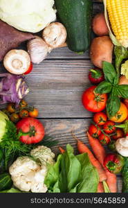 Various vegetables on a wooden table with copy space