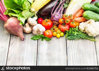 Various vegetables on a wooden table with copy space. Vegetables on wooden table