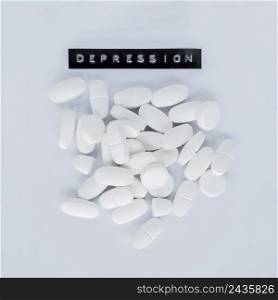 various white pills with depression label grey background