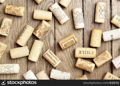 Various wine corks over wooden surface