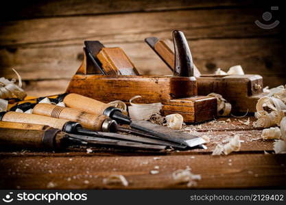 Various working tools on wood on the table. On a wooden background. High quality photo. Various working tools on wood on the table.