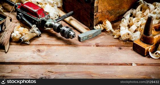 Various working tools on wood on the table. On a wooden background. High quality photo. Various working tools on wood on the table.