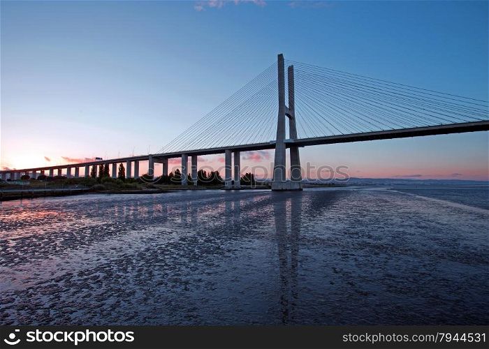 Vasco da Gama Bridge at sunset in Lisbon Portugal