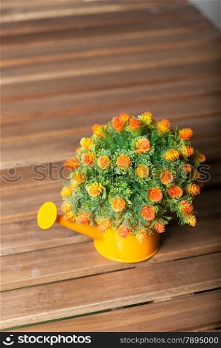Vase flower pot. Placed on a table made of wood inside the house.
