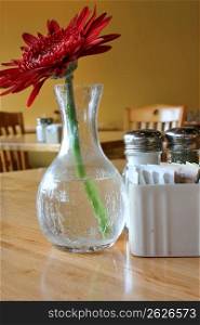 Vase on table with flower in restaurant