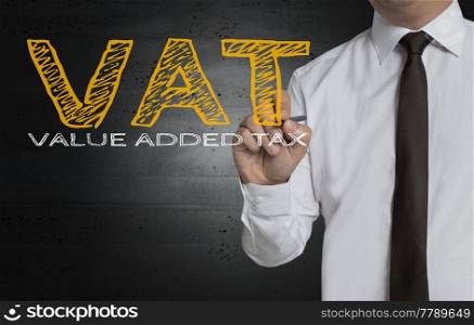 VAT is written by businessman on screen.. VAT is written by businessman on screen