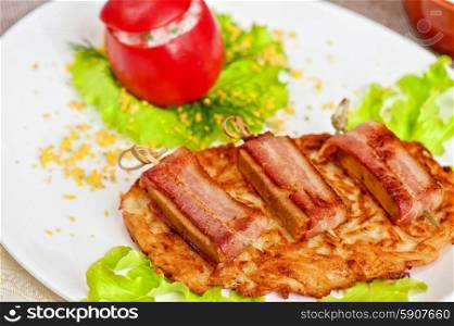 veal meat with bacon. roast of veal meat with bacon with potatoes