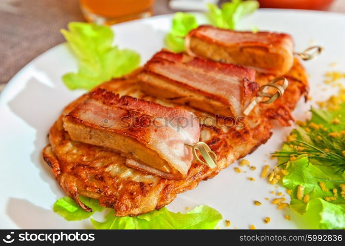 veal meat with bacon. roast of veal meat with bacon with potatoes