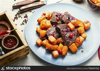 Veal stewed with pumpkin and cranberry sauce. Roasted beef with pumpkin