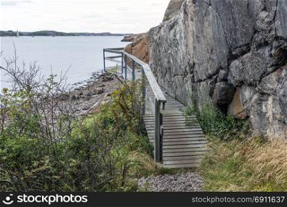 veddoarkipelagen walking track in sweden, a walk with wooden wooden balustrade construction build around the rocks