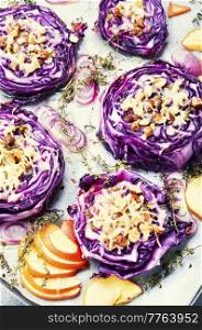 Vegan autumn dish of red cabbage, apples and nuts. Baked vegan red cabbage steaks. Banquet autumn food. Roasted red cabbage, vegetarian steak.