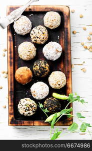 Vegan chocolate truffles. Dietary sweets with chickpeas, raisins, dried apricots and nuts. Clean food