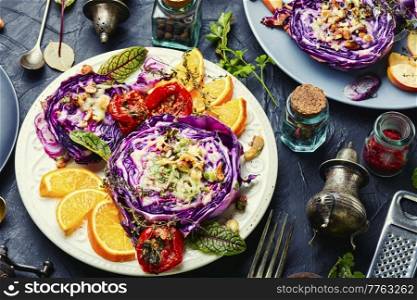 Vegan dish of baked red cabbage, orange and nuts. Healthy appetizer.. Vegetable vegan red cabbage appetizer.