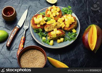 Vegan food, tasty quinoa cutlet. Meatless burger with mango. Vegan quinoa cutlets