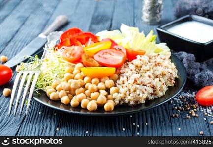 vegan food, vegetables and qinoa on plate