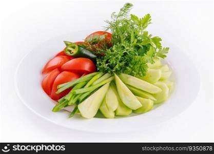 Vegan plate of fresh sliced cucumbers, green onions and cherry tomatoes