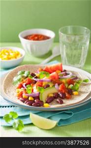 vegan taco with vegetable, kidey beans and salsa