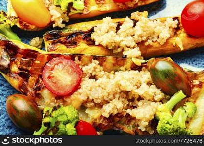 Vegetable appetizer with grilled zucchini,broccoli,tomato and quinoa.Summer food.. Roasted zucchini with broccoli and quinoa.