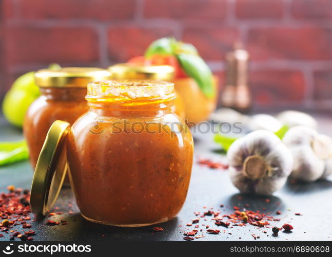 vegetable caviar in glass bank and on a table