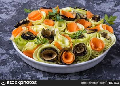 Vegetable chopped spiral. Salad from chopped eggplant, squash and carrots