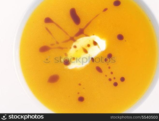 vegetable cream soup closeup isolated on white background