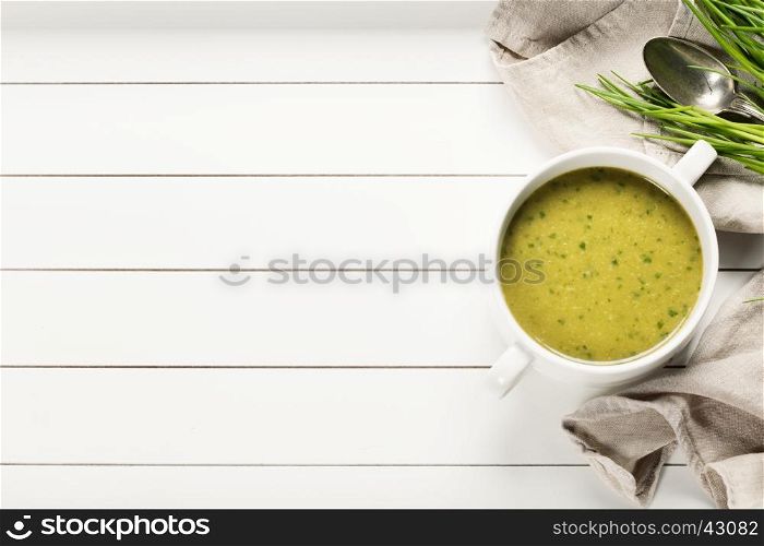 Vegetable cream soup on white rustic background