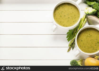 Vegetable cream soup on white rustic background