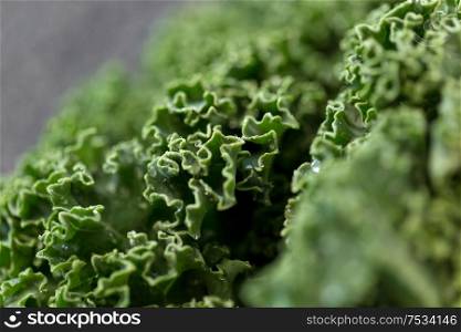 vegetable, food and culinary concept - close up of kale cabbage on table. close up of kale cabbage on table