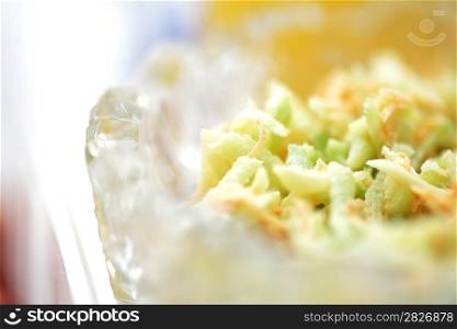 Vegetable salad closeup with white chicken meat