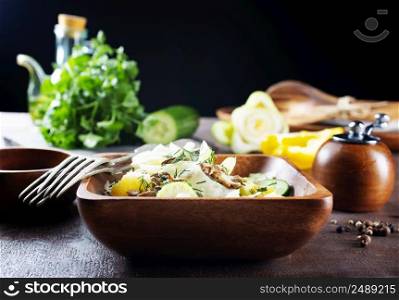 vegetable salad with avocado in bowl. vegetable salad with avocado and fresh cucumber