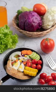 Vegetable salad with bread and boiled eggs in the pan. Selective focus.