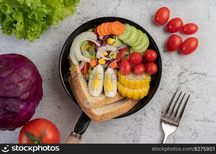 Vegetable salad with bread and boiled eggs in the pan. Selective focus.