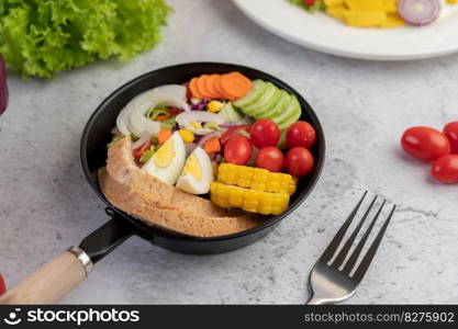 Vegetable salad with bread and boiled eggs in the pan. Selective focus.