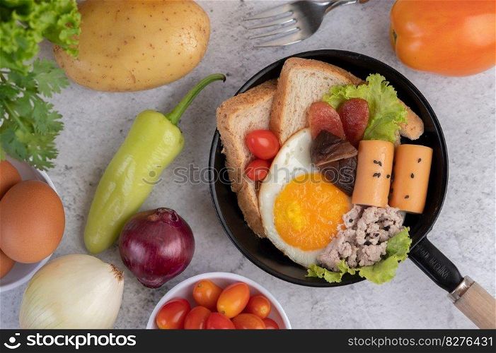 Vegetable salad with bread and boiled eggs in the pan. Selective focus.