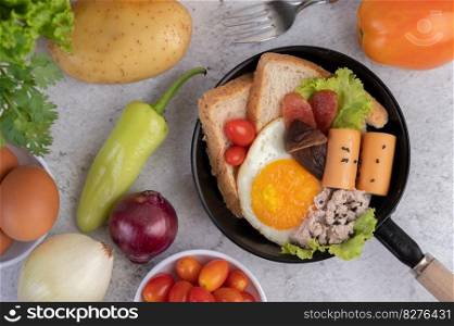 Vegetable salad with bread and boiled eggs in the pan. Selective focus.