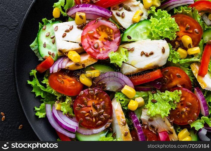 Vegetable salad with chicken meat. Salad with chicken breast and raw vegetables