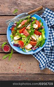 Vegetable salad with chicken meat. Salad with fresh vegetables and grilled chicken fillet