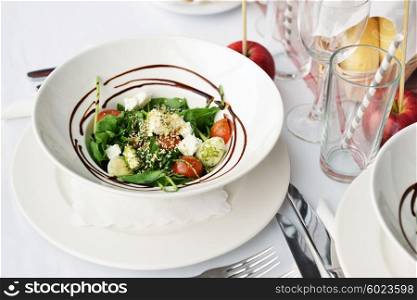 Vegetable salad with feta cheese and sesame seeds