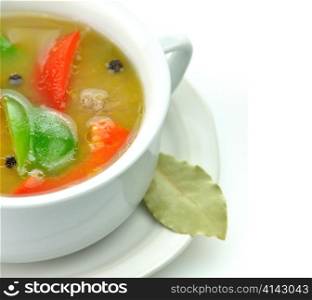 vegetable soup in a white soup cup