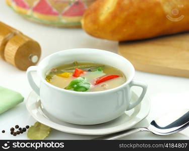 vegetable soup in a white soup cup