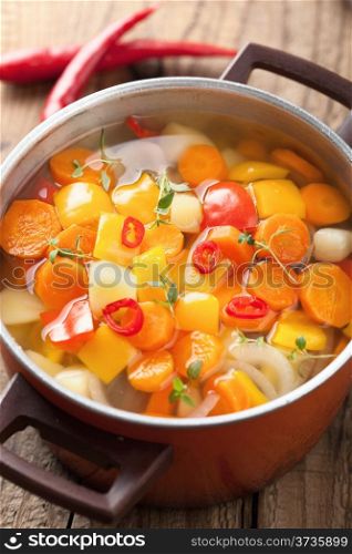 vegetable soup in red pot