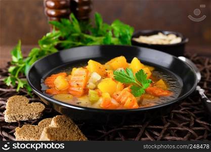 Vegetable soup with carrot, potato and pumpkin. Healthy vegetarian food
