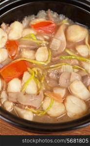 Vegetable soup with mushrooms closeup