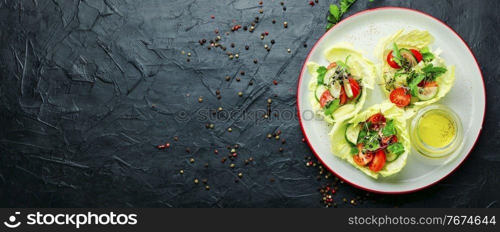 Vegetable spring salad with cabbage,cucumber,tomato and herbs.Healthy vegetable salad.Spring food. Plate of salad with vegetables and green
