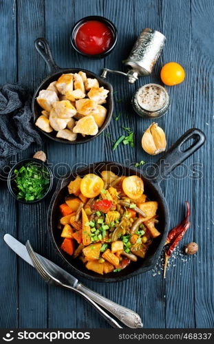 vegetable stew in pan, fried vegetables with oil and spice