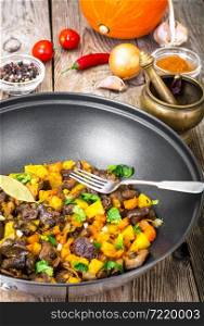 Vegetable stew with pumpkin, celery and mushrooms. Studio Photo. Vegetable stew with pumpkin, celery and mushrooms