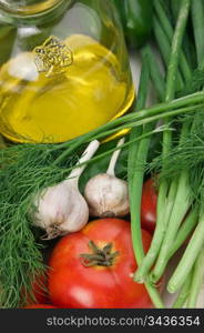 vegetables and a bottle of oil, still life