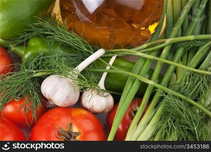 vegetables and a bottle of oil, still life