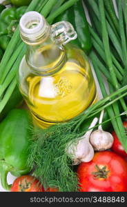 vegetables and a bottle of oil, still life