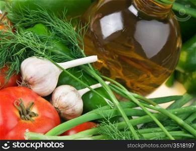 vegetables and a bottle of oil, still life
